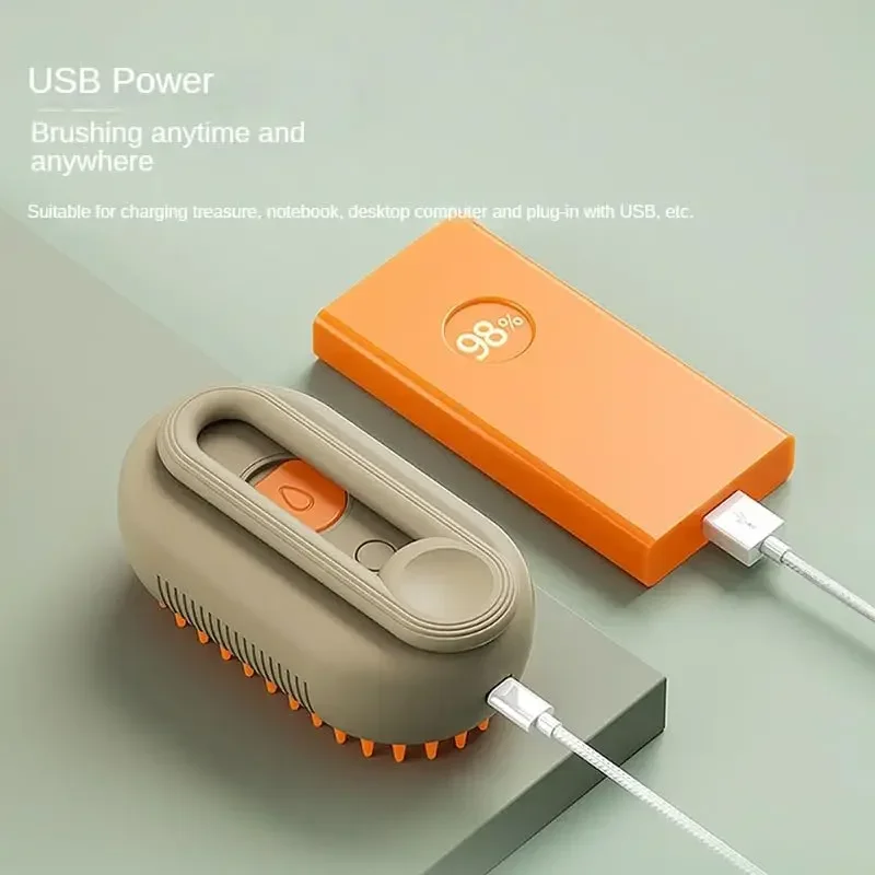 USB-powered Cat & Dog Steamy Brush per la Cura del Pelo di Cani e Gatti, ideal for brushing anytime and anywhere.